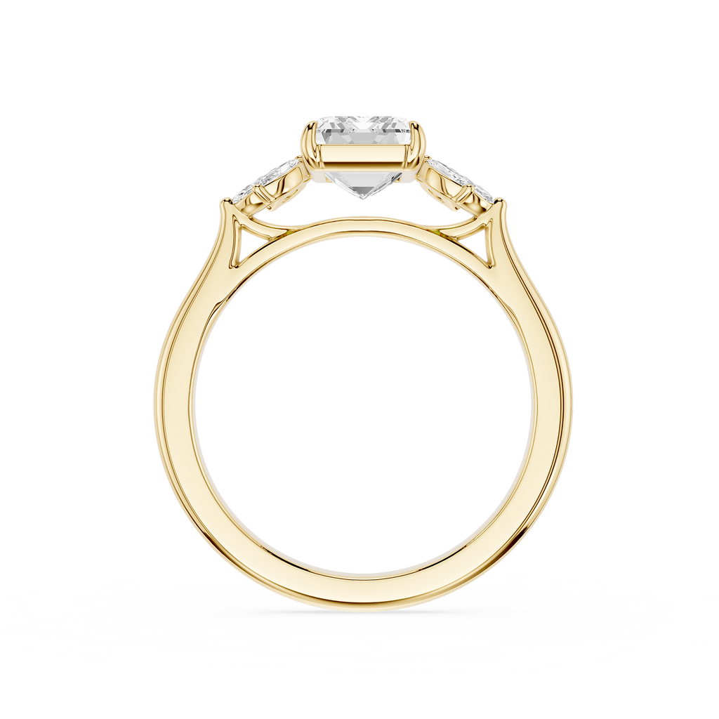 A yellow gold ring with a marquise-cut center stone and smaller side stones, shown from a top-down view on a white background.