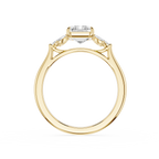 A yellow gold ring with a marquise-cut center stone and smaller side stones, shown from a top-down view on a white background.