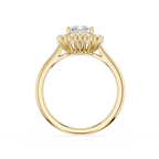 A rose gold ring with a unique prong setting holding a clear round gemstone, shown on a solid white background.