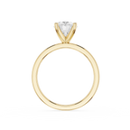 A yellow gold solitaire engagement ring featuring a triangular-cut clear gemstone in a prong setting, shown against a plain white background.
