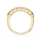 A yellow gold ring with a row of small clear gemstones set in a curved, fan-like arrangement on the band, shown against a plain white background.