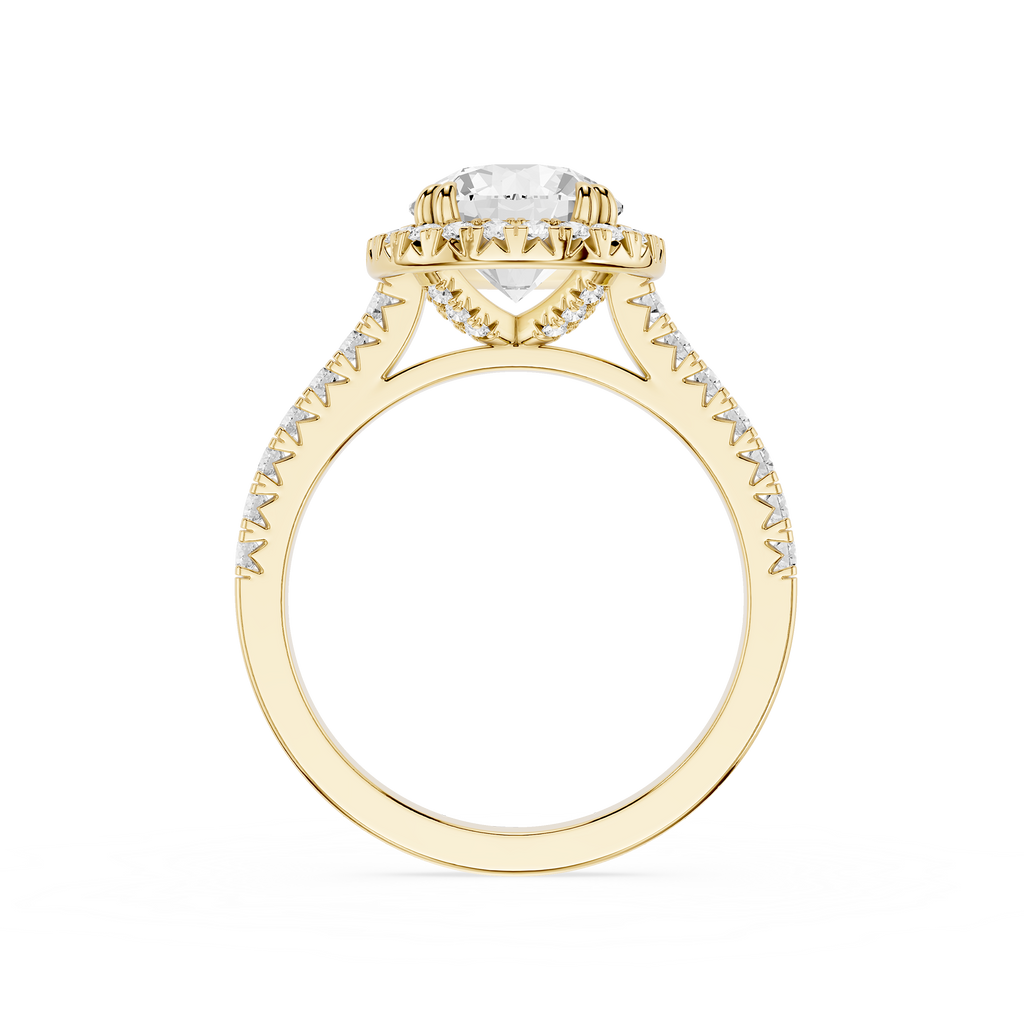 A yellow gold ring with a heart-shaped clear gemstone in a halo setting, accented by small pavé diamonds along the shoulders, shown on a plain white background.