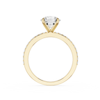 A yellow gold solitaire engagement ring featuring a round brilliant-cut diamond center stone and a pavé band with small diamonds, shown on a plain white background.