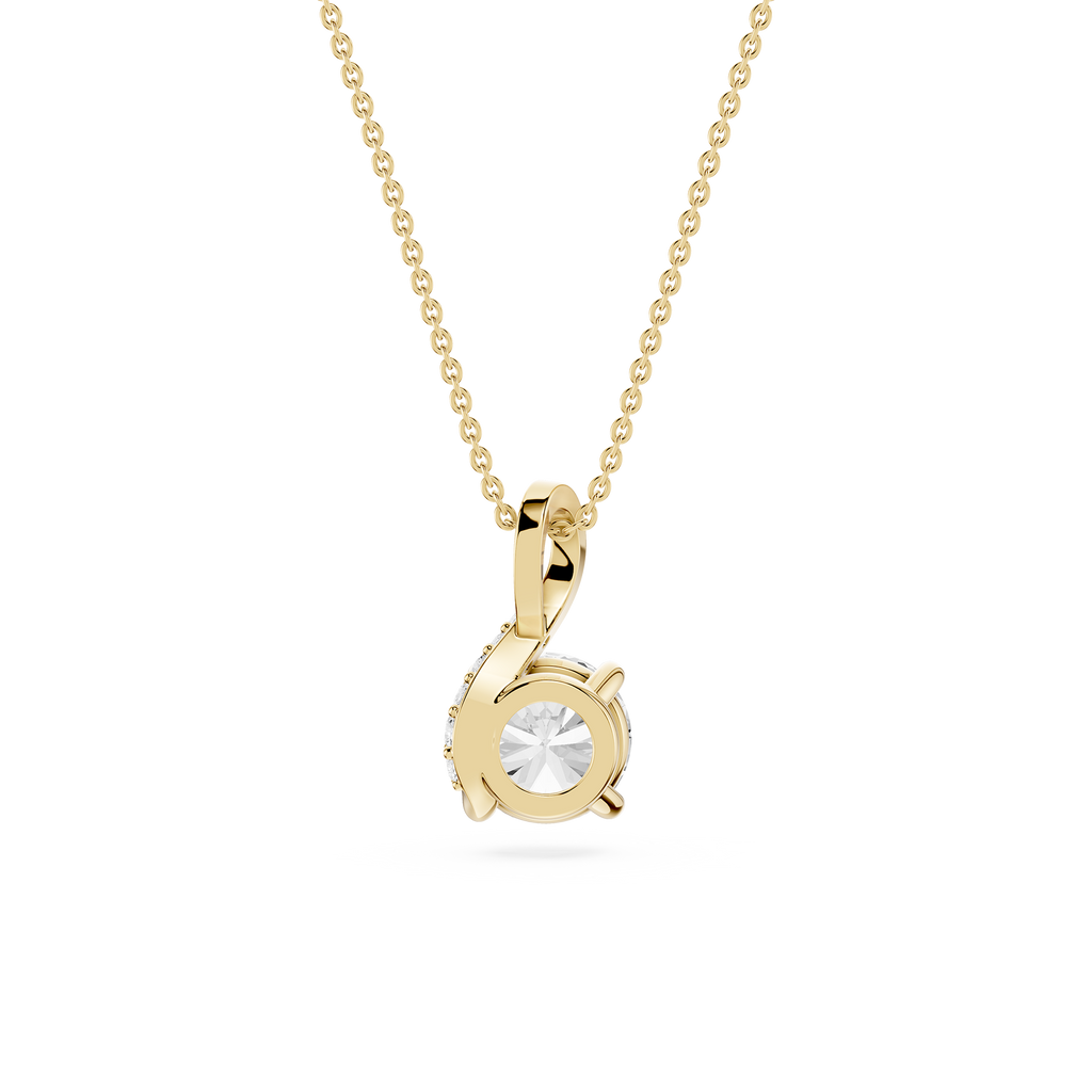 Gold necklace with a round pendant on a white background
