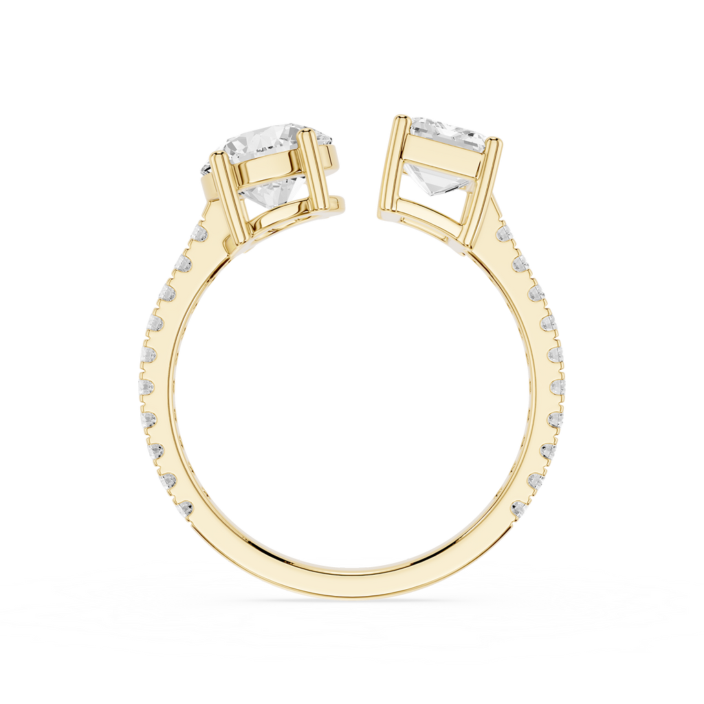 A gold ring with two large clear rectangular-cut center stones and a channel-set row of small clear stones along the band, shown on a plain white background.