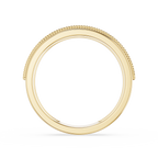 Gold ring with beaded design on a white background