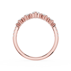 Rose gold ring with diamond accents on a white background