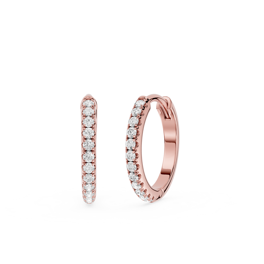 Rose gold hoop earrings with embedded diamonds on a white background