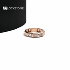 Rose gold emerald cut lab grown diamond wedding band featuring horizontally set rectangular stones and a geometric design