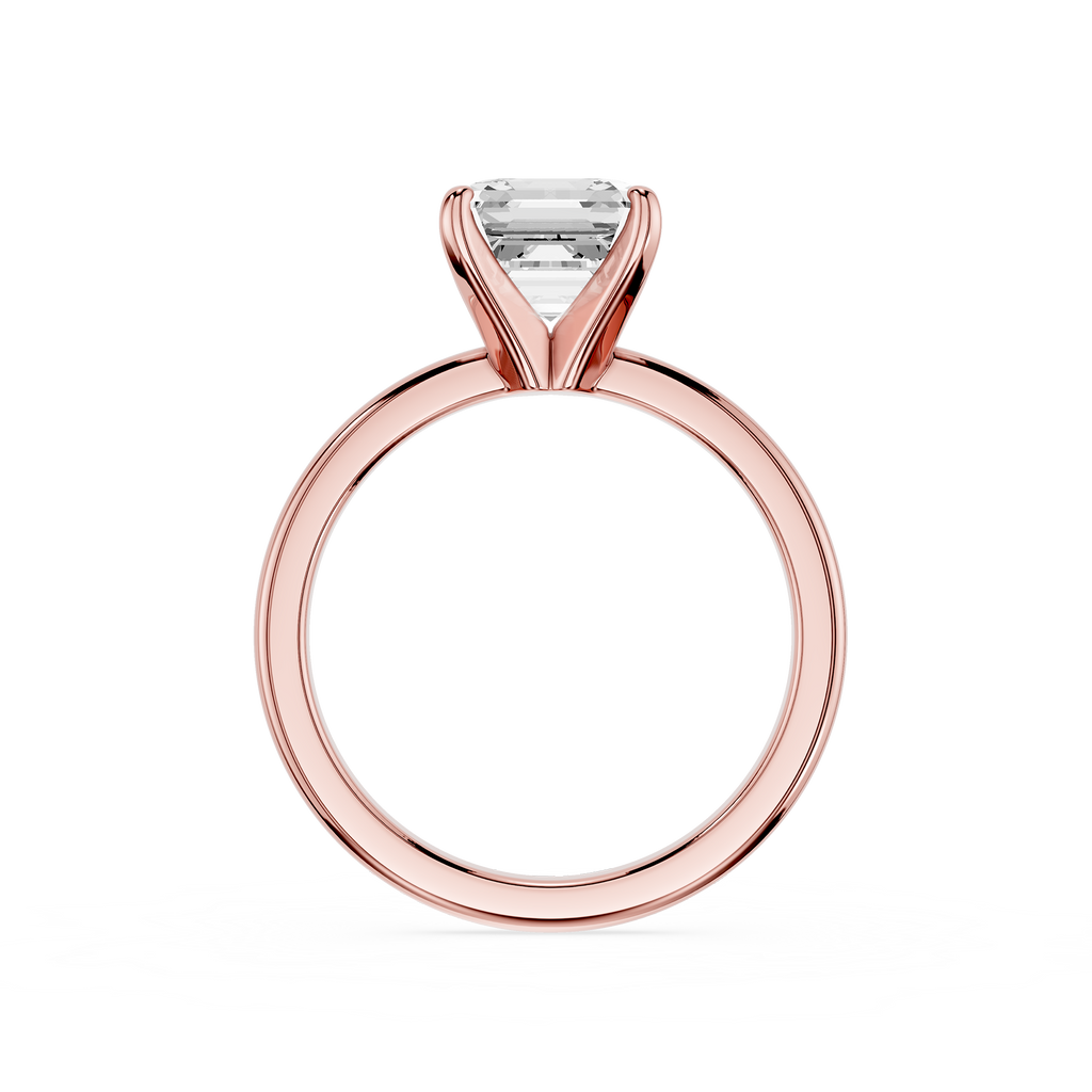 Rose gold ring with a clear gemstone on a white background