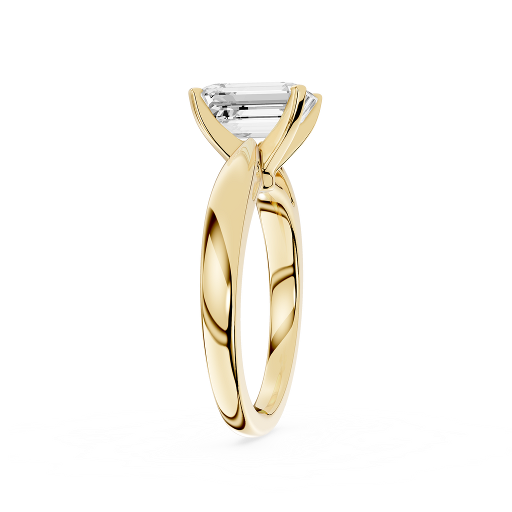 Gold ring with a diamond on a white background