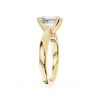 Gold ring with a diamond on a white background