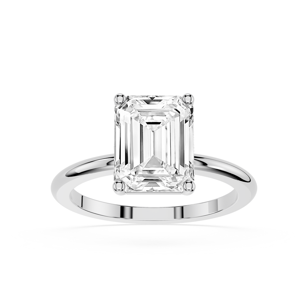 Diamond ring with emerald-cut diamond on a white background