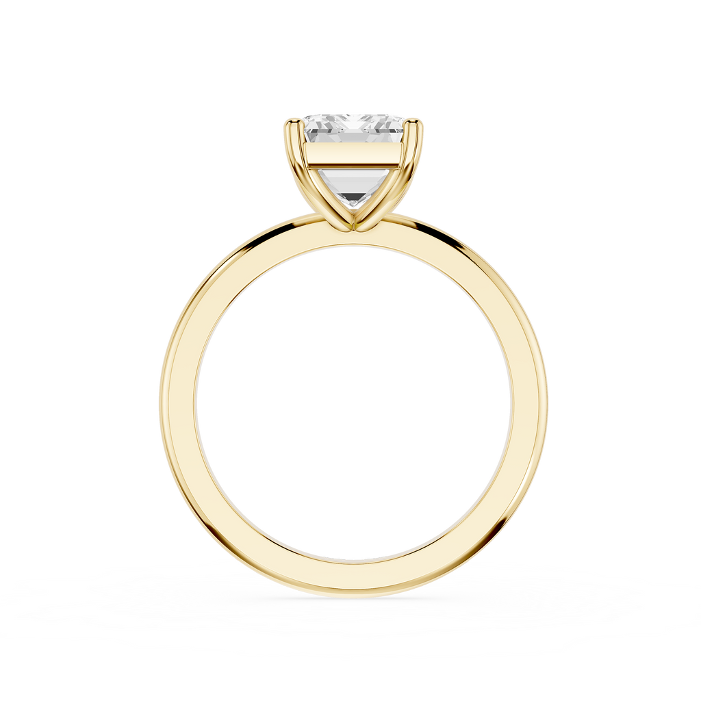 Gold ring with a diamond on a white background