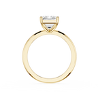 Gold ring with a diamond on a white background