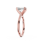 Rose gold ring with a diamond on a white background