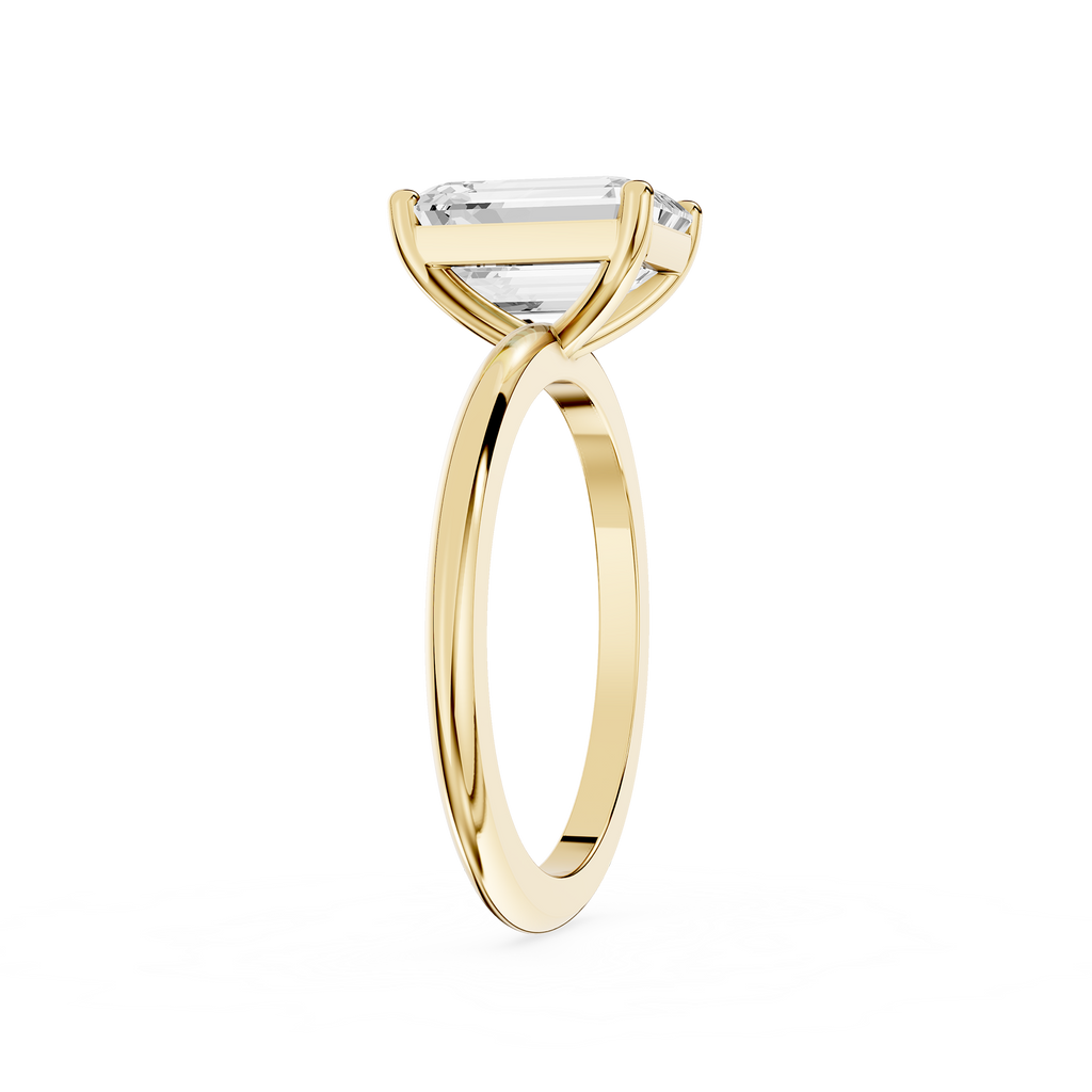 Gold ring with a diamond on a white background