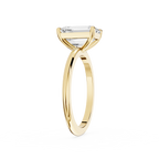 Gold ring with a diamond on a white background
