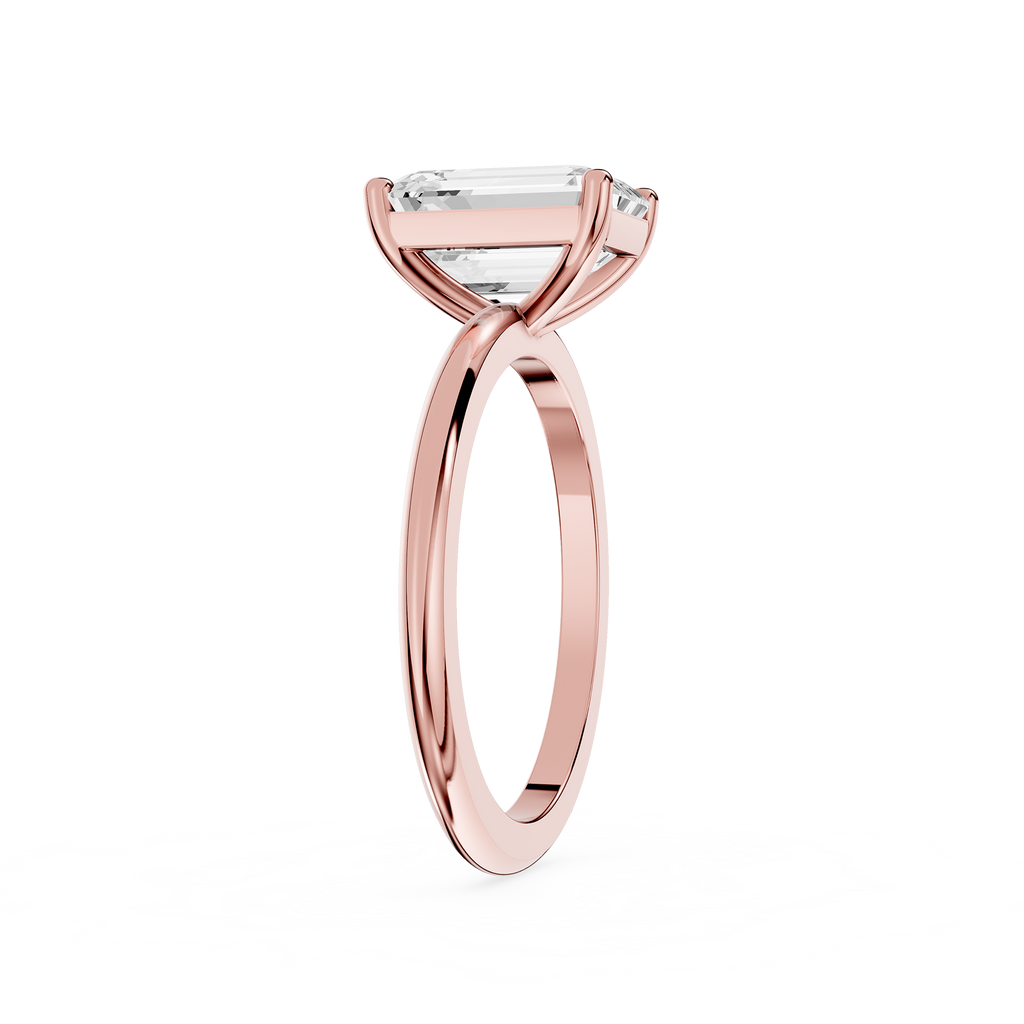 Rose gold ring with a diamond on a white background