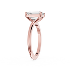 Rose gold ring with a diamond on a white background