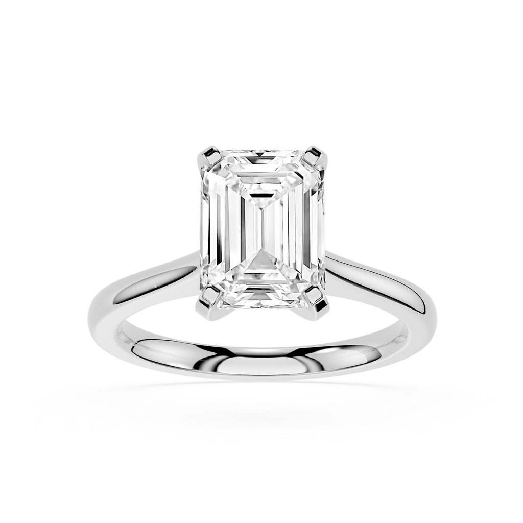 Gold ring with a diamond on a white background