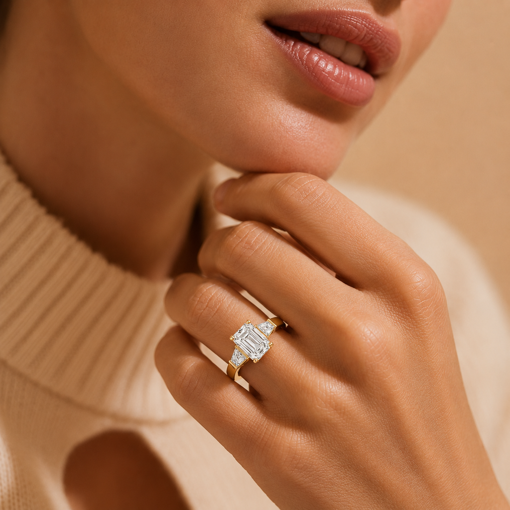 Close-up of a hand wearing a diamond ring with a blurred background