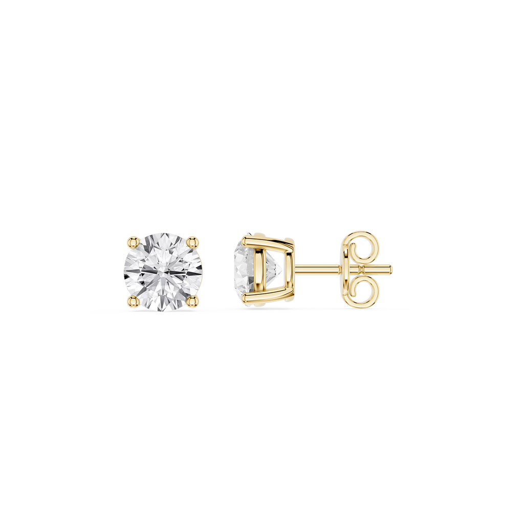 Gold earrings with clear gemstones on a white background