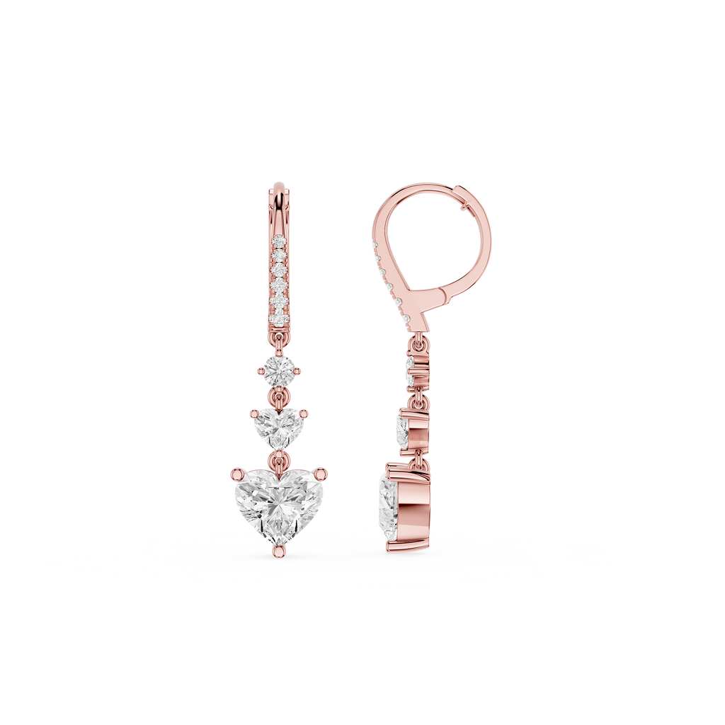 Rose gold earrings with heart-shaped and round gemstones on a white background