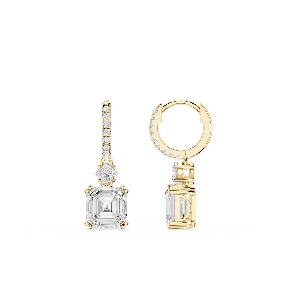 Gold hoop earring and diamond stud earring on a white background