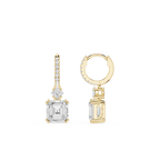 Gold hoop earring and diamond stud earring on a white background