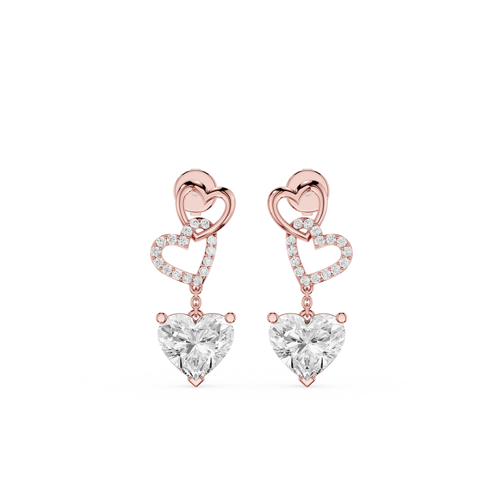 Rose gold heart-shaped earrings with clear gemstones on a white background