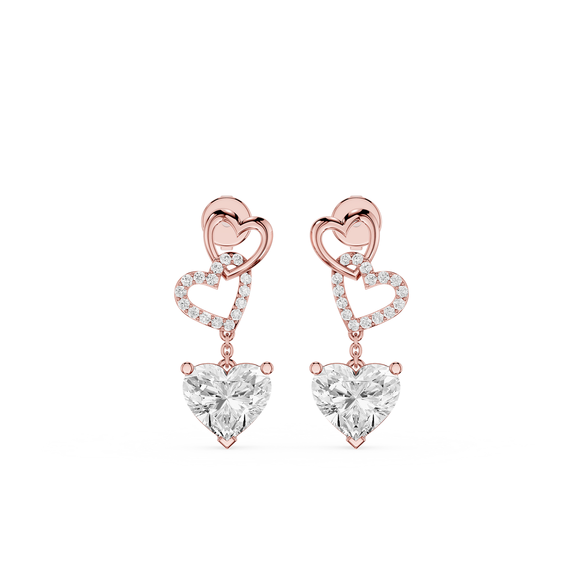 Rose gold heart-shaped earrings with clear gemstones on a white background