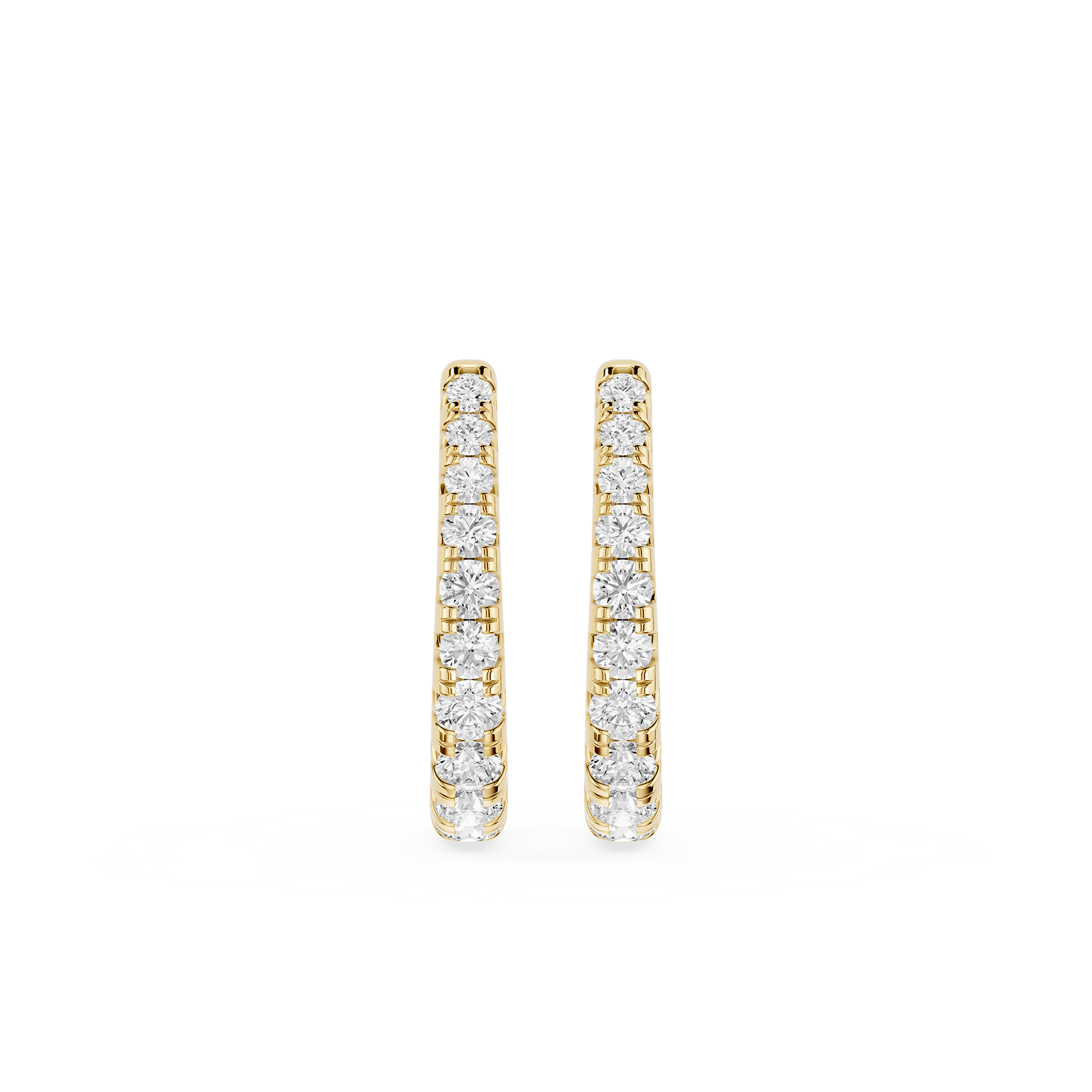 Gold hoop earrings with clear gemstones on a white background