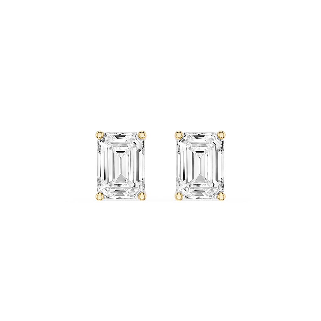 Pair of emerald-cut diamond stud earrings on a white background