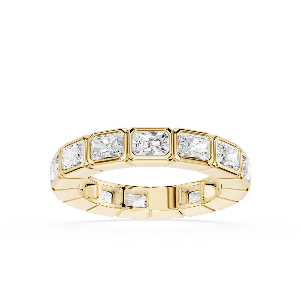 A yellow gold eternity ring featuring a row of rectangular baguette-cut clear gemstones, shown on a clean white background.