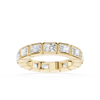 A yellow gold eternity ring featuring a row of rectangular baguette-cut clear gemstones, shown on a clean white background.