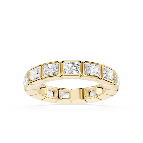 A yellow gold eternity ring featuring a row of rectangular baguette-cut clear gemstones, shown on a clean white background.