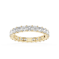 A yellow gold eternity ring featuring a continuous row of baguette-cut clear diamonds on the top and smaller round diamonds on the sides, set against a plain white background.