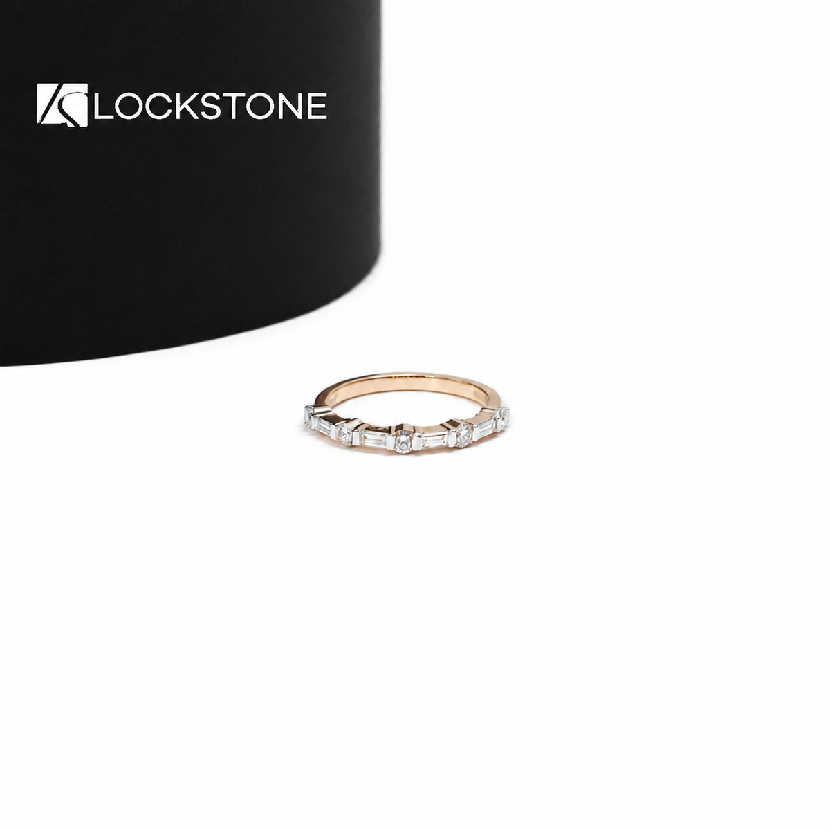 Rose gold lab grown diamond wedding band featuring alternating baguette and round cut diamonds on a slim band