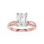 Rose gold ring with a large diamond on a white background