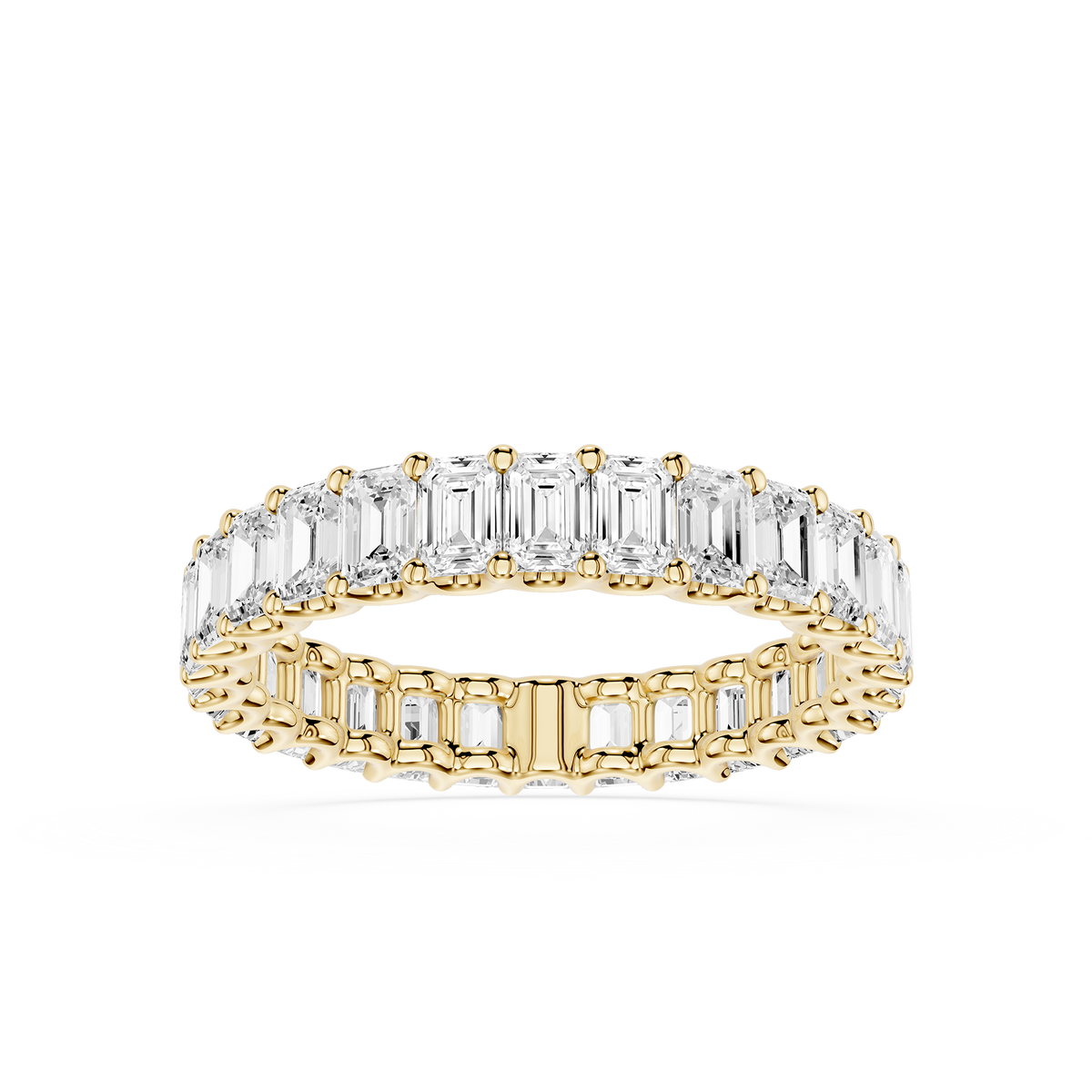 Emerald-cut lab-grown diamond eternity ring in 18KT yellow gold band and shallow shared prongs.