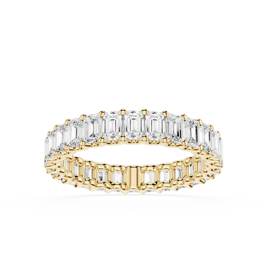 A yellow gold eternity ring featuring a double row of baguette-cut clear gemstones, shown on a clean white background.