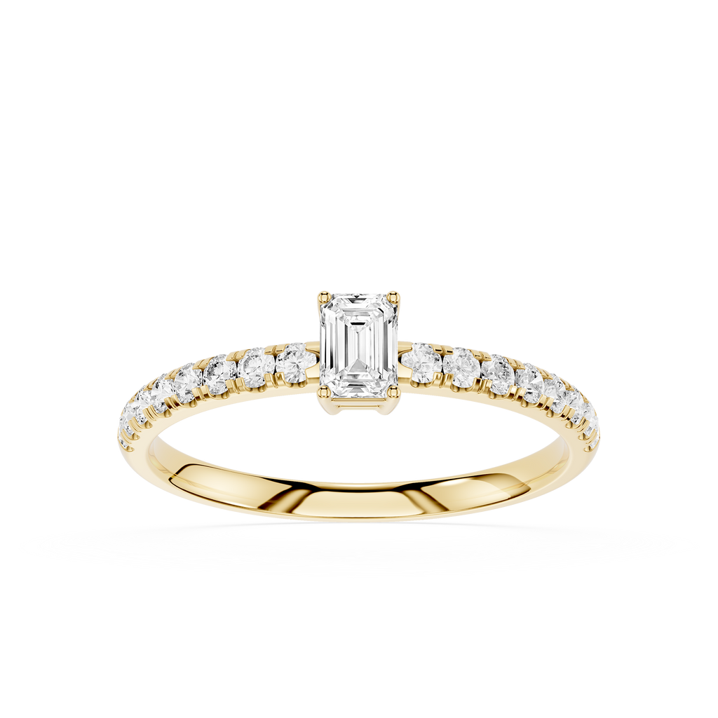 Gold ring with emerald-cut diamond and smaller diamonds on a white background