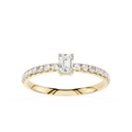 Gold ring with emerald-cut diamond and smaller diamonds on a white background