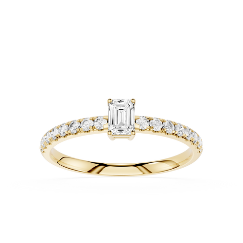 Gold ring with emerald-cut diamond and smaller diamonds on a white background