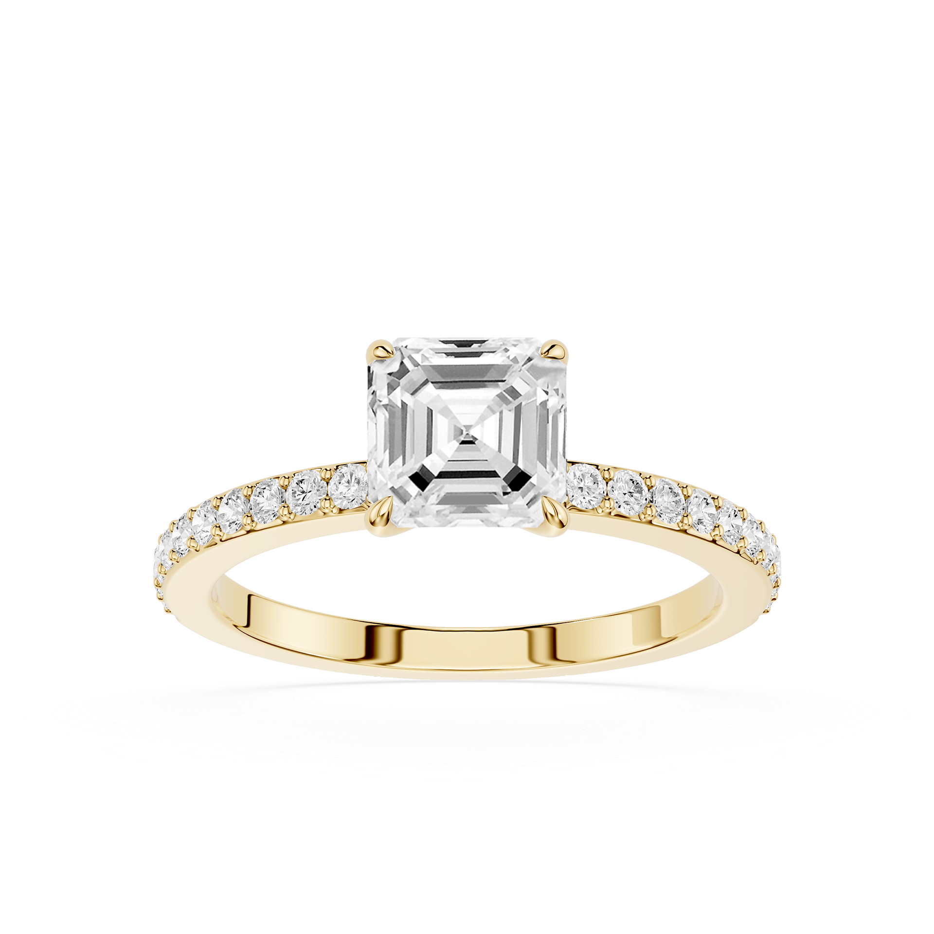 An emerald-cut diamond engagement ring in a Yellow-colored metal setting, featuring a pave band with small round diamonds, shot against a solid white background.