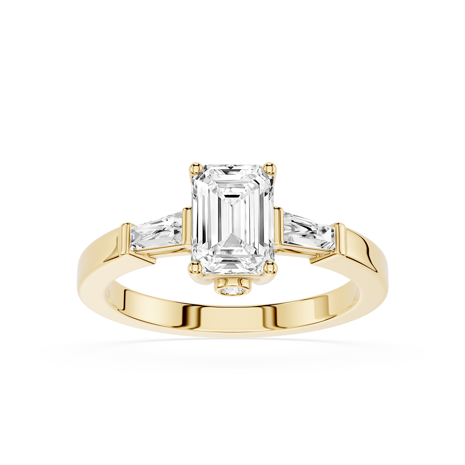 Gold ring with emerald-cut diamond and baguette side stones on a white background