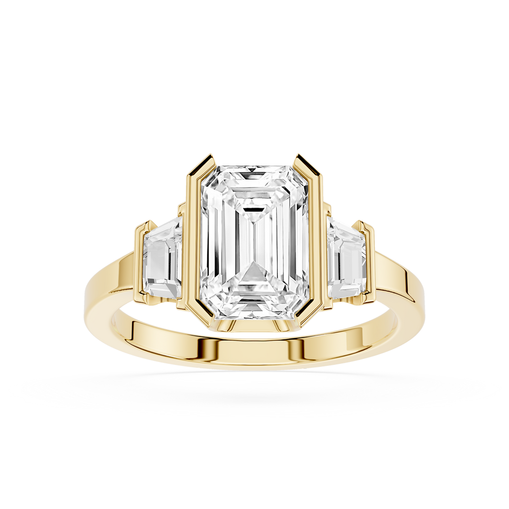 Gold ring with emerald-cut diamond on a white background