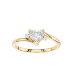 Gold ring with a heart-shaped diamond on a white background