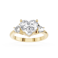 Gold ring with a heart-shaped diamond and smaller diamonds on a white background